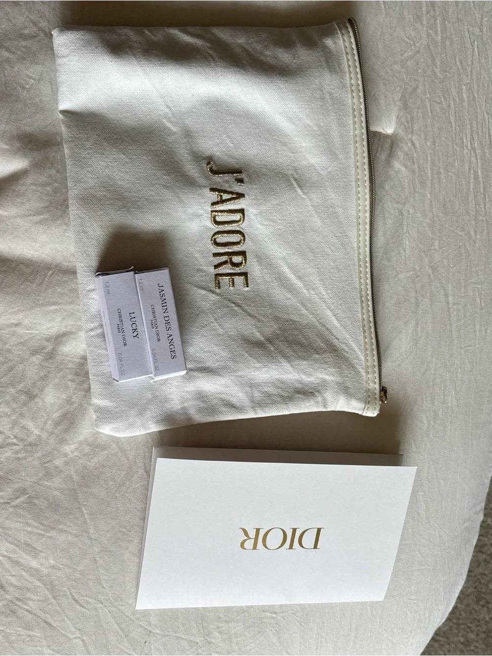 J'ADORE Embroidered White Cosmetic Pouch with Gold Lettering Two mini perfumes